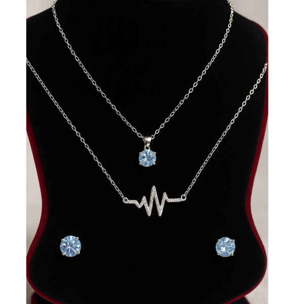 necklace with matching radiant crystal stud earrings.