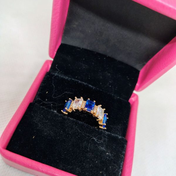 vibrant gold ring adorned with colorful gemstones,