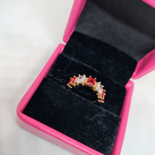 vibrant gold ring adorned with colorful gemstones