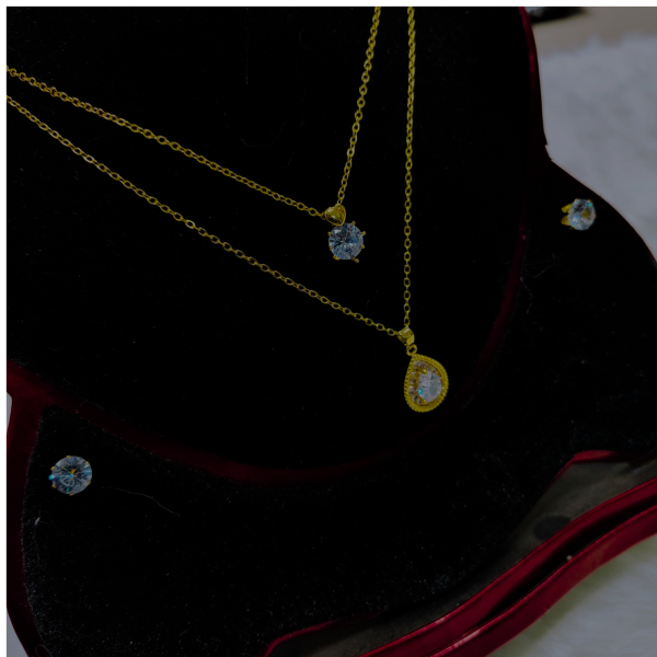necklace with matching radiant crystal stud earrings.