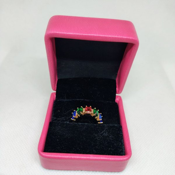 vibrant gold ring adorned with colorful gemstones,