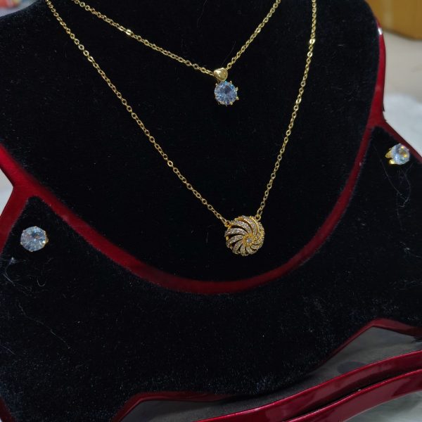 necklace with matching radiant crystal stud earrings.