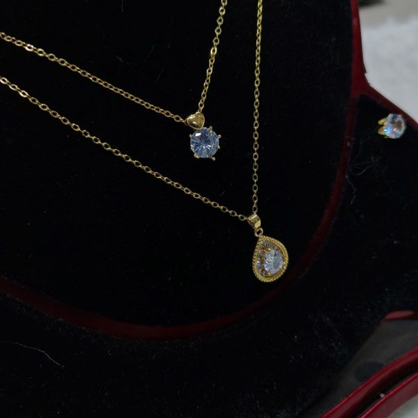 necklace with matching radiant crystal stud earrings.