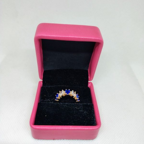 vibrant gold ring adorned with colorful gemstones,