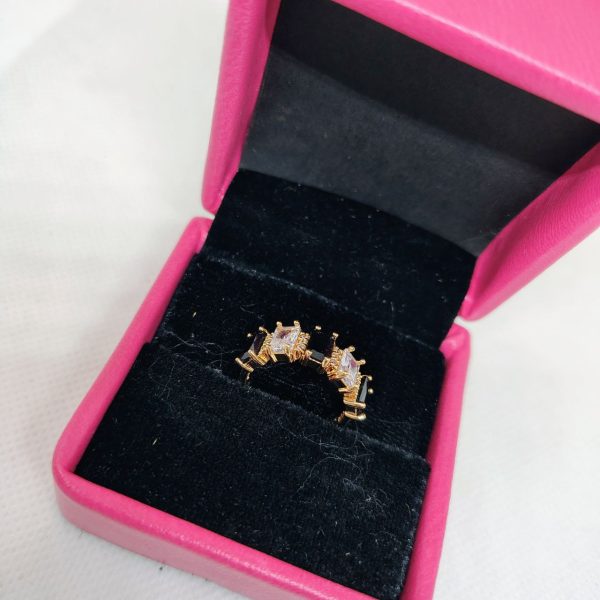 vibrant gold ring adorned with colorful gemstones.