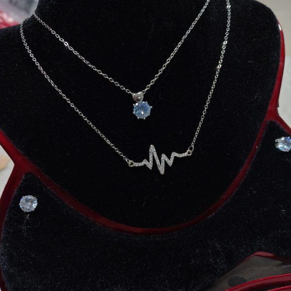 necklace with matching radiant crystal stud earrings.