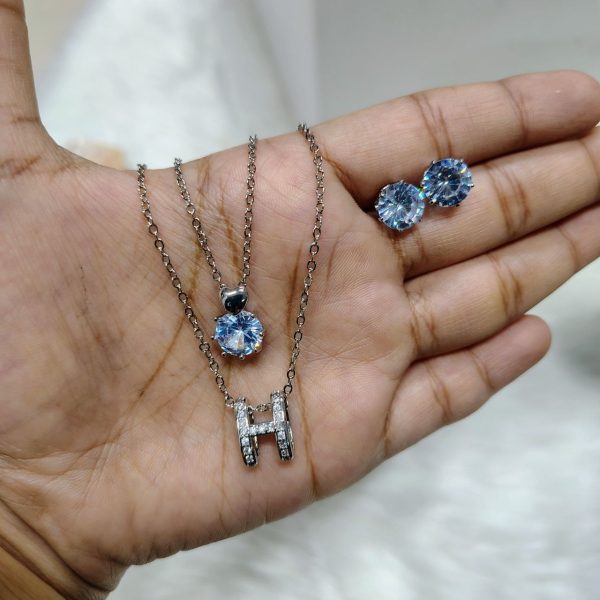 necklace with matching radiant crystal stud earrings.