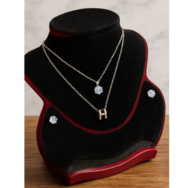 necklace with matching radiant crystal stud earrings.