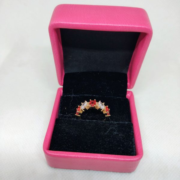 vibrant gold ring adorned with colorful gemstones