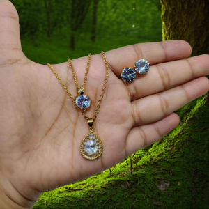 necklace with matching radiant crystal stud earrings.