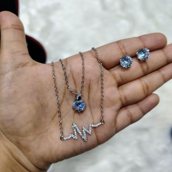 necklace with matching radiant crystal stud earrings.