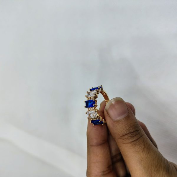 vibrant gold ring adorned with colorful gemstones,