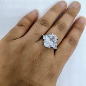A radiant three-stone ring symbolizing past, present, and future love