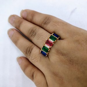 vibrant gold ring adorned with colorful gemstones,
