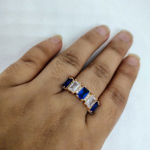 vibrant gold ring adorned with colorful gemstones,